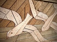 Close-up of wood lath mosaic fish detail