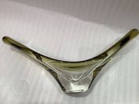 Front view of moss green chalet art glass fruit bowl, showing elongated symmetrical triangular shape with smooth curves and thick base.