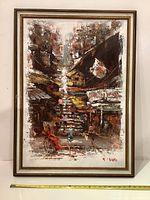 Full view of vintage oil painting in wooden frame showing Asian street market with multiple buildings and figures.