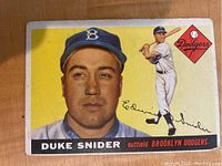 Front of 1955 Topps Duke Snider baseball card showing player portrait, Dodgers logo and signature, with some corner wear and minor surface imperfections
