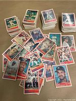 Multiple stacks and spread of about 160 baseball cards from 1988 Sportflics Magic Motion series showing various players