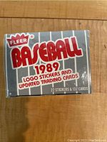 Photo of sealed 1989 Fleer Baseball Logo Stickers and Updated Trading Cards box, showing front side with text about 22 stickers and 132 cards.