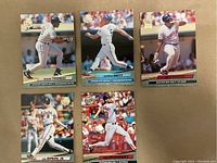 Photo showing five different baseball cards from the 1992 Fleer Ultra set including Frank Thomas, George Brett, Cal Ripken Jr., and Tom Brunansky in action poses.