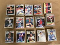 Stacks of individual 1989 Fleer Baseball cards arranged by team, showing front faces of multiple player cards including pitchers and batters.