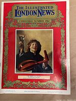 Front cover of the magazine showing 'The Merry Slave Player' painting by Sir Joshua Reynolds, Christmas Number 1964 edition with decorative red and gold border.