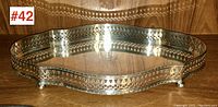Full view of the silver plated gallery tray, showing the pierced gallery sides and shaped rectangular top.