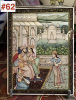 Full view of the hand painted miniature showing a royal court scene with seated king, queen, attendants, landscape, and architectural background.