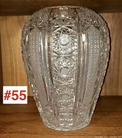 Front view of the large cut crystal vase showing vertical panels with star and circle cut patterns.