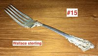 Full view of the Wallace sterling silver dinner fork showing length and fork tines.