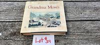 Full front cover image of Grandma Moses book showing winter landscape painting.