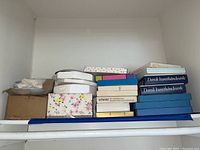 Stack of boxed plates including Dansk Kunsthåndværk and other collectible plate boxes