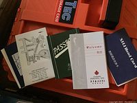 Photo of various Asian hotel cards and booklets, some with maps and welcome messages