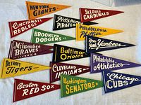 All pennants laid out on cloth background