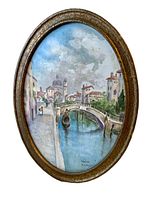 Front view of the oval porcelain plaque painted with a Venice canal scene in a gold-tone frame.