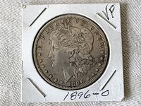 Obverse side of 1896 O Morgan Silver Dollar showing Lady Liberty profile and date 1896 with visible mint mark 'O'.