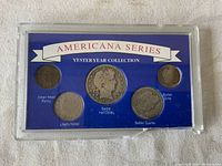 Front view of Americana Series Yesteryear Collection plastic display case showing five coins: Indian Head Penny, Liberty Nickel, Barber Half Dollar, Barber Quarter, Barber Dime.