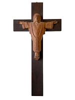 Front view of large wooden crucifix showing the carved figure of Christ with outstretched arms mounted on a dark wooden cross.