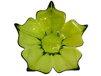 Top view showing the petal-shaped edges and textured crackle effect of the green glass bowl.