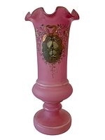 Full view of the pink Victorian glass vase with hand painted floral designs and scalloped rim.