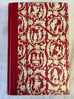 Front cover of the vintage hardcover book The World's Best Fairy Tales with red and gold decorative design and red spine.