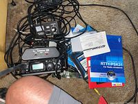 Overhead view of FT-817 transceiver, Z-817 tuner, SignaLink USB, MFJ-813 meter, cables and manuals