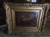Overall view of framed oil painting showing subject scene and ornate gilt frame