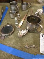 Overview of all sterling items arranged on carpet