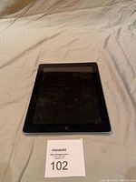 Front view of the Apple iPad 2 showing the screen and home button