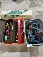 Image showing two boxes containing various hand tools and the original box of Alto's 4501 mat cutting system in background.