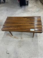 Full overhead view showing the slatted top and legs