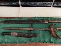 Overview of all three items laid out on green cloth