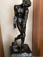 Front view of bronze sculpture and pedestal