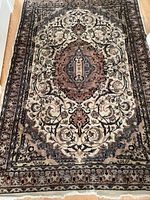 Full view of rug showing central medallion and overall pattern