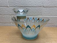 Front and side view of vintage glass chip and dip set with frosted bases and gold, blue, and turquoise arch patterns.