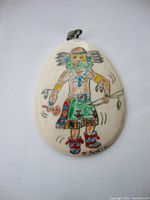 Photo of the pendant showing front detail and signature