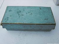 Mottled turquoise metal storage box with hinged lid