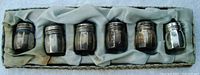 Six shakers nestled in original cloth-lined presentation box without cover.