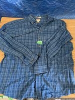 Blue plaid XL-Tall L.L.Bean flannel shirt laid flat showing front, sleeves, and buttons.