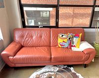 Front view of sofa showing full length and cushion condition