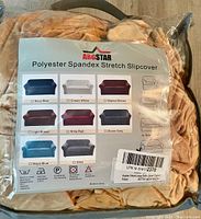 Front view of packaged Argstar Polyester Spandex Stretch Slipcover in camel color. Shows color options and sofa size compatibility (extra large 92-118 inches).