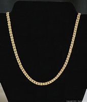 Full view of necklace displayed on black bust showing overall length and style