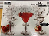 Box showing 12 piece Libbey Margarita Party glass set with plastic storage box and recipe booklet included.