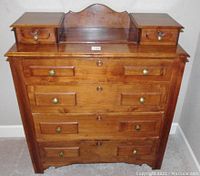 Front full view of antique wooden dresser showing four drawers and two top drawers