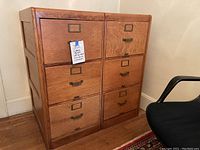 Front view of both cabinets side by side showing three drawers each and metal hardware