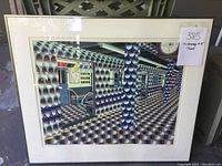 Full view of framed print showing subway car, platform and patterned columns, with price label visible