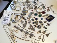 Overhead view of all sterling pieces on white surface