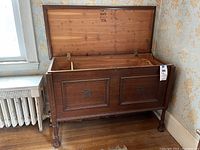 Front view of open cedar chest showing interior lift out tray and cedar wood lining.