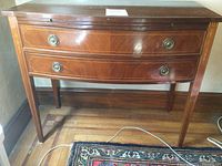 Full front view of curved-front sideboard, showing overall style and condition