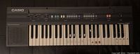 Top down image showing full keyboard with controls and speaker grill on left side