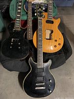 Overview of three single-cut and one double-cutaway bodies stacked on bag and bin